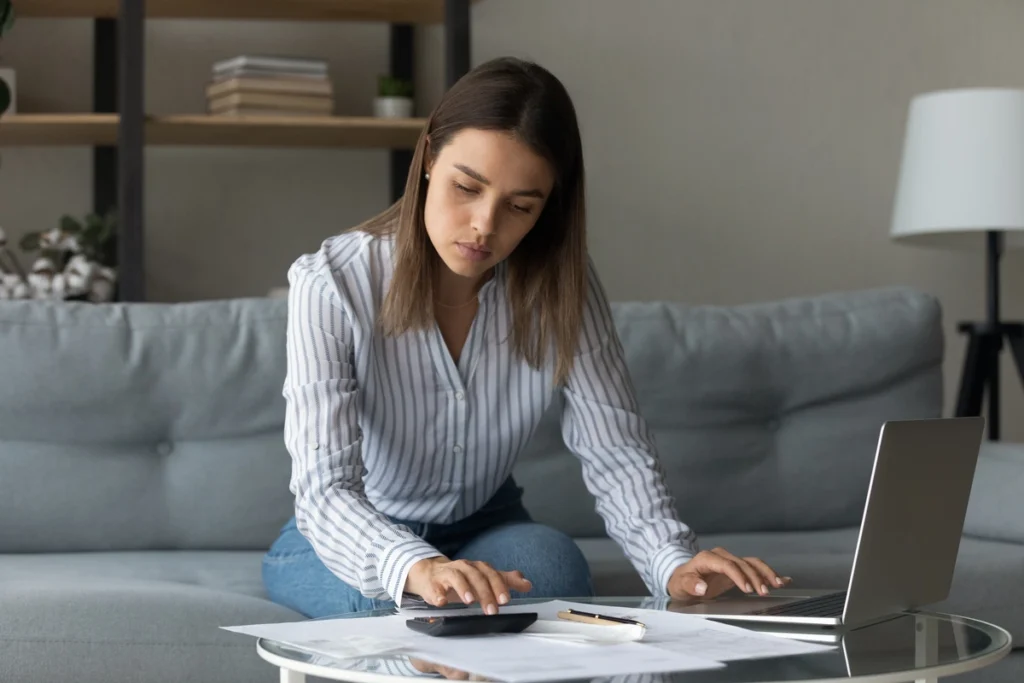 Used - young homeowner filling papers for roof financing