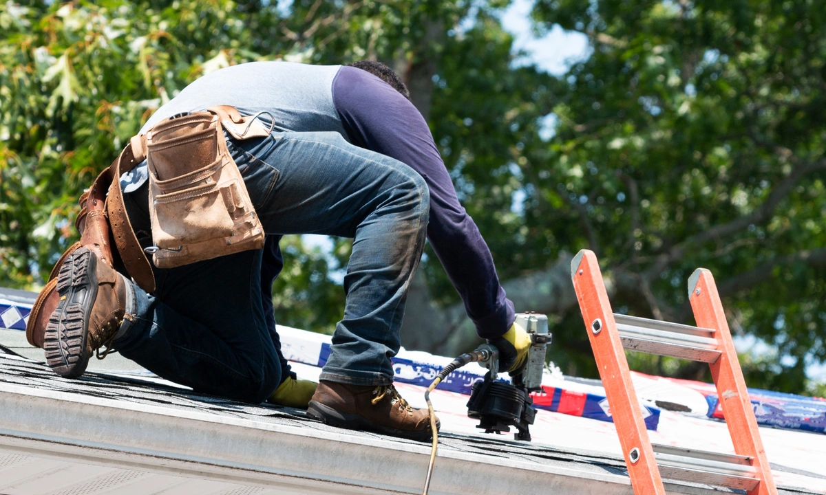 Used - Roofing contractor uses nail gun in order to replace roofing shingles