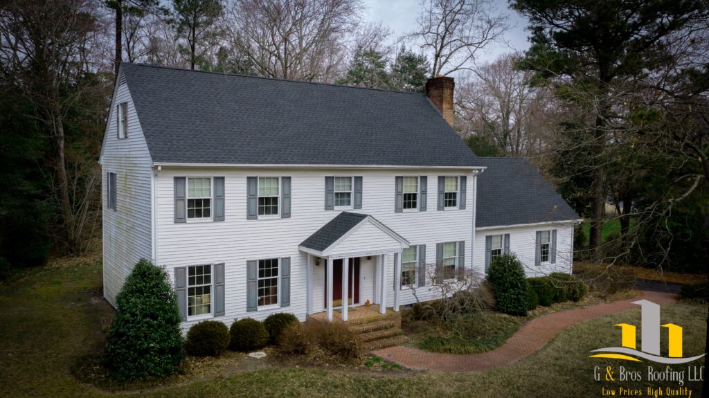 Used - Grey asphalt shingle roofing project completed by G and Bros on white house GAF Timberline HDZ Roof Replacement Roofing Contractor Salisbury MD