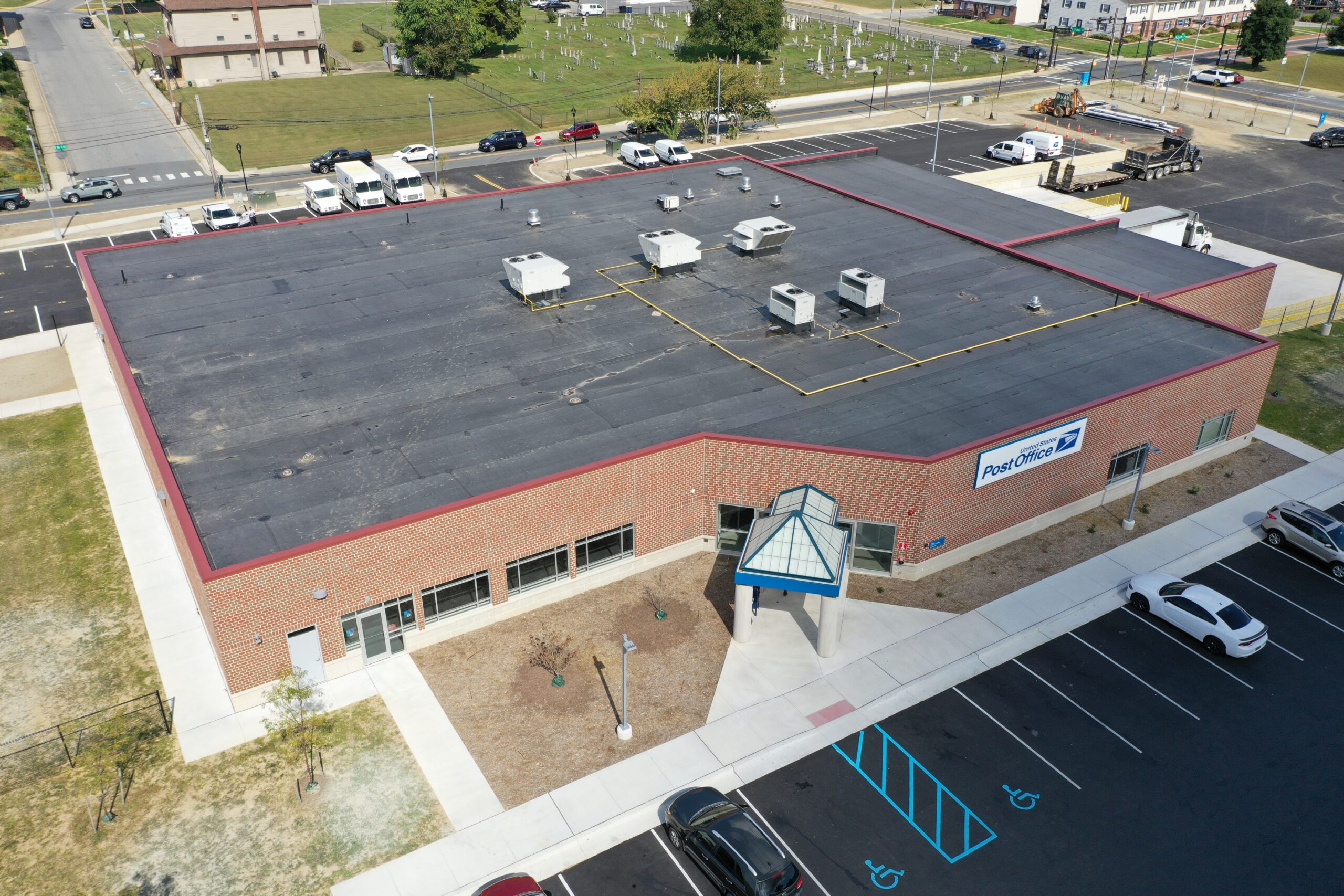 Aerial view of a Delmarva commercial building with a TPO membrane roof in good condition