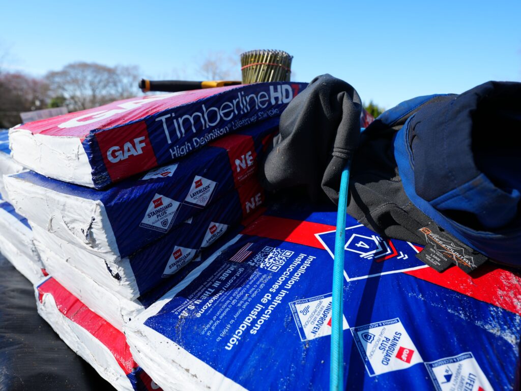 Used - GAF Timberline HDZ Shingles on the roof with some tools on top of them in Salisbury MD