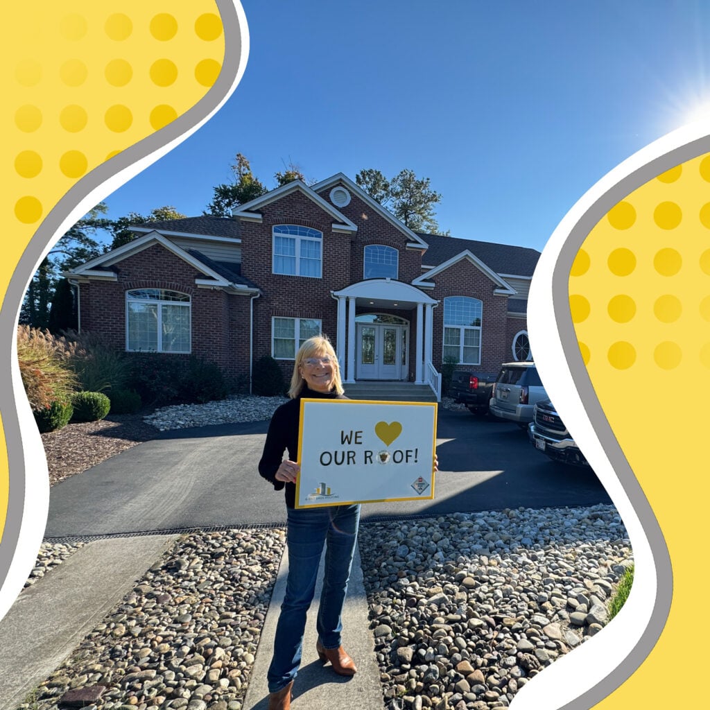 Used - Robin Franks, a G and Bros Customer, holding a sign saying "We love our roof" G and Bros the local roofing contractor based in Salisbury MD replaced her old roof that was damaged by a storm for a new GAF Timberline HDZ roof.