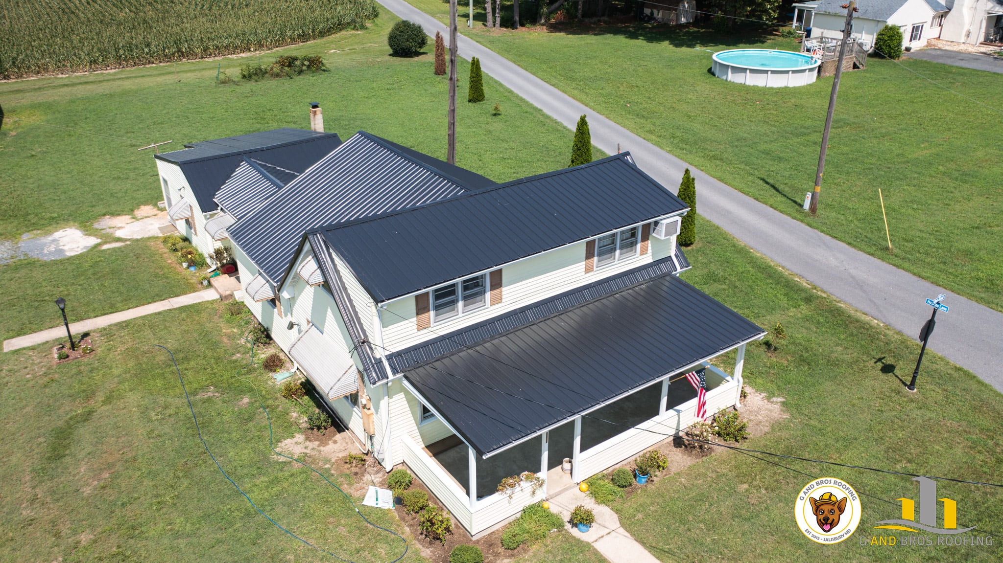 Metal roof on a beautiful house done by G and Bros