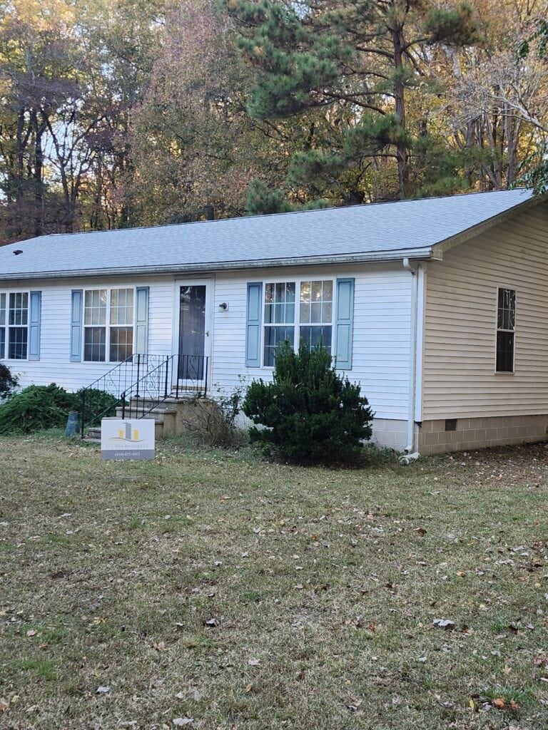 Used - White vinyl-sided home in Millsboro DE with new GAF Timberline HDZ Fox Hollow Gray shingles, installed by G and Bros