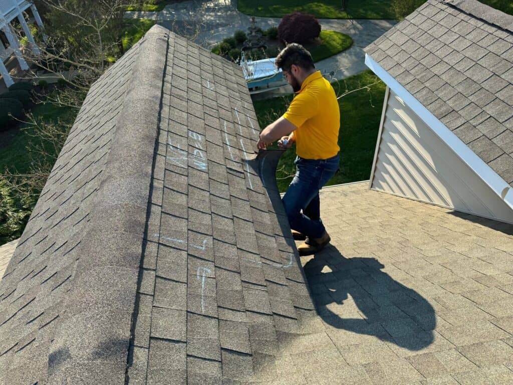 Used - Guillermo Molina Matus inspecting a roof after a storm. G and Bros a roofing company in Salisbury, MD that does all of the eastern shore of maryland.