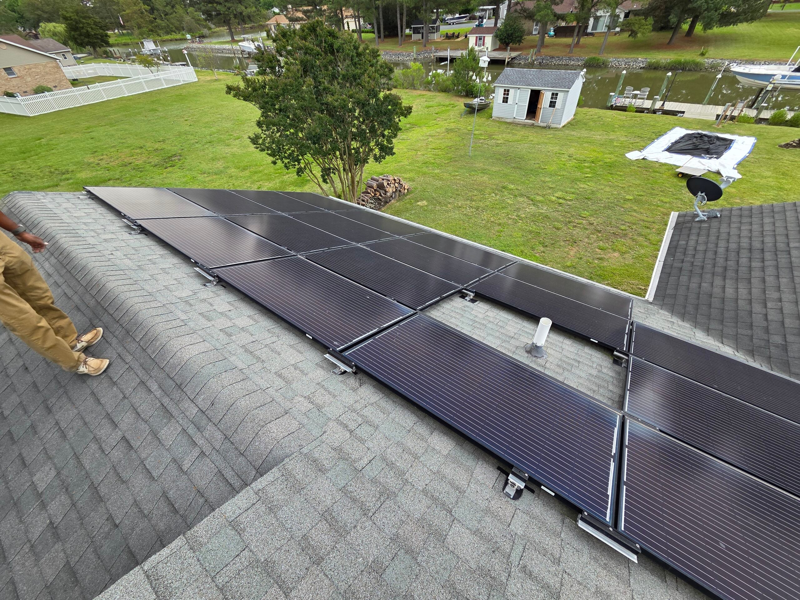 What to Do to Your Roof Before Installing Solar Panels: A Delmarva Homeowner's Pre-Solar Checklist 2 | G and Bros G and Bros crew member inspecting a Delmarva roof before solar panel installation