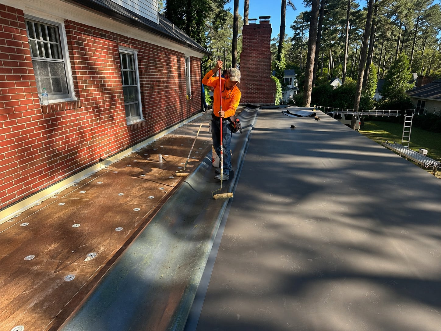 Commercial Roof Replacement: What to Expect from Start to Finish 2 | G and Bros Delmarva commercial roof mid-replacement with old material torn off and new insulation on the deck