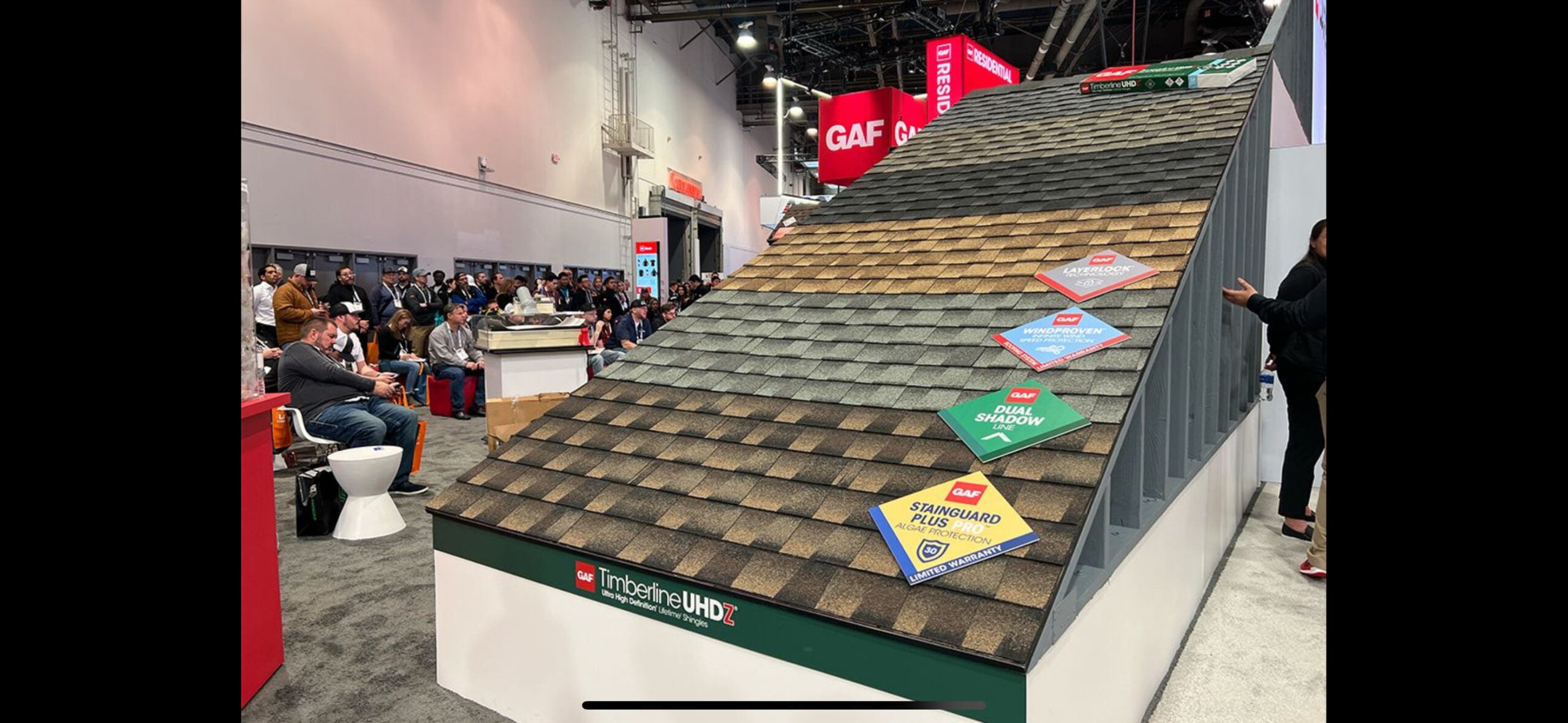 How to Choose the Right Roofing Color for Your Delmarva Home 2 | G and Bros Architectural shingle color samples laid side by side against a Delmarva home exterior