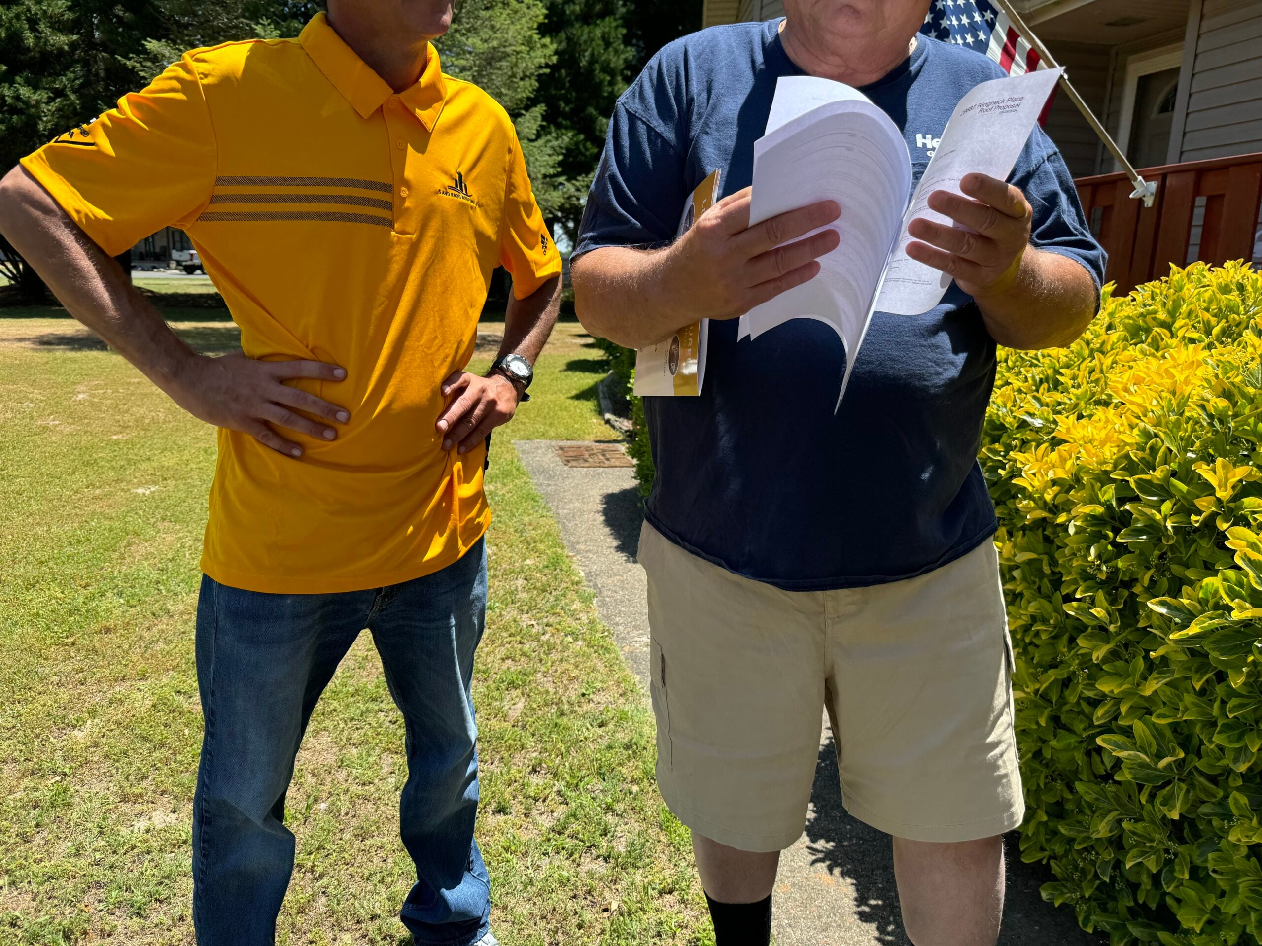 How to Choose a Roofing Contractor in Sussex County, Delaware: What to Ask Before You Sign 2 | G and Bros G and Bros roofing professional reviewing a written roofing estimate with a homeowner before a roof replacement project in Sussex County, Delaware